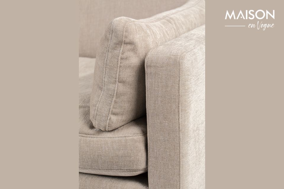 The seat and back cushions reveal their softness at first glance, inviting you to linger