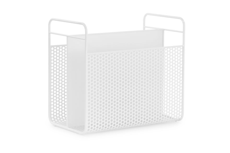 The magazine rack\'s hole-patterned sides are inspired by the computer equipment of the 90\'s that