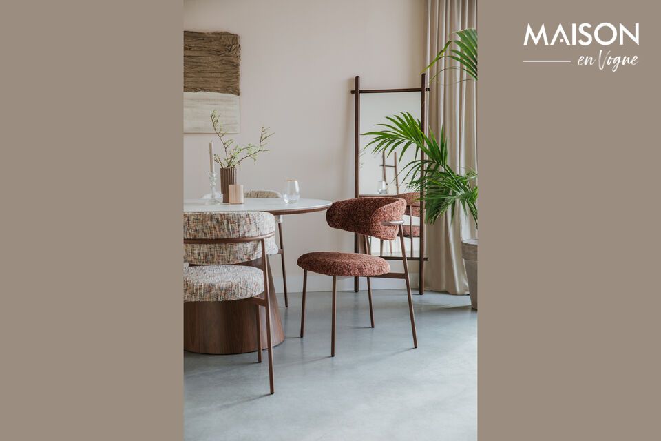 The Claes beige fabric chair evokes the conviviality of a modern yet welcoming dining space