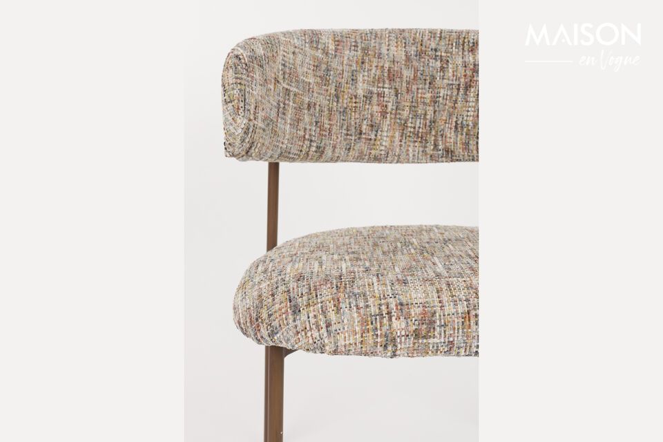 The Claes beige fabric chair is more than just a piece of furniture; it becomes a witness to shared