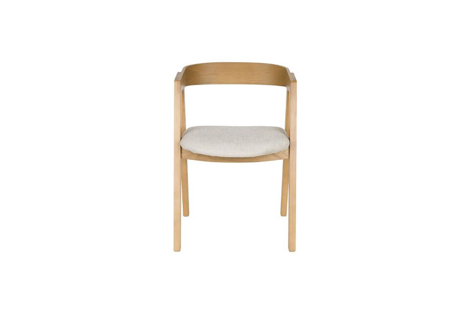 The gracefully curved silhouette of the backrest suggests discreet elegance
