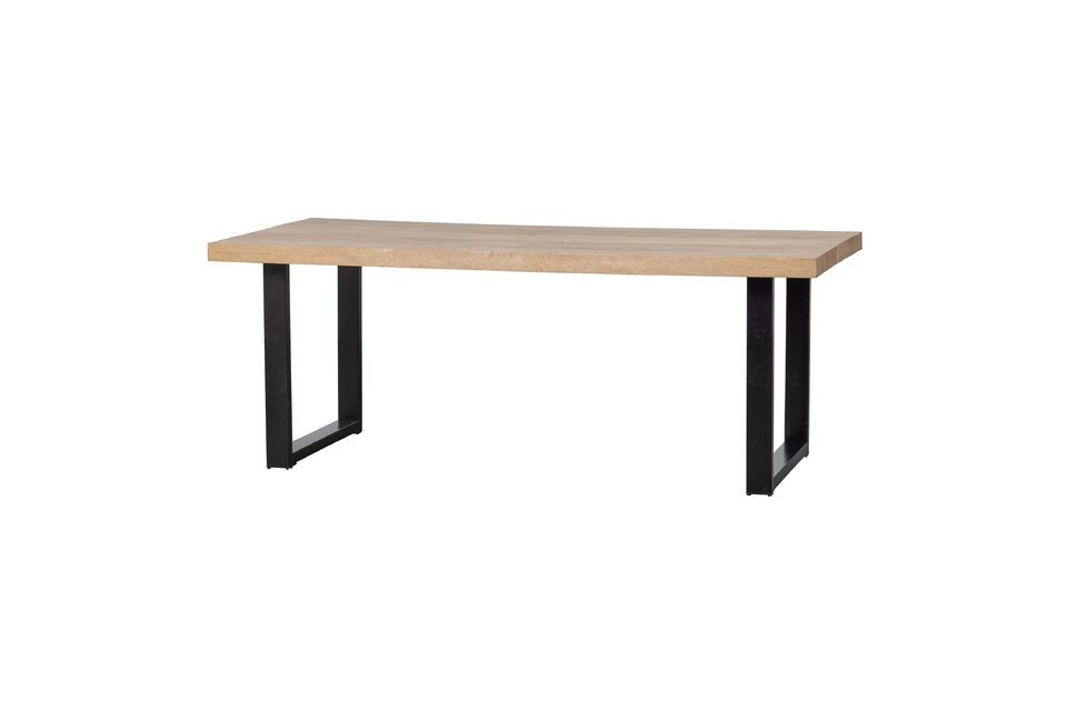 This Tablo mango wood dining table is a perfect blend of sturdiness and contemporary style
