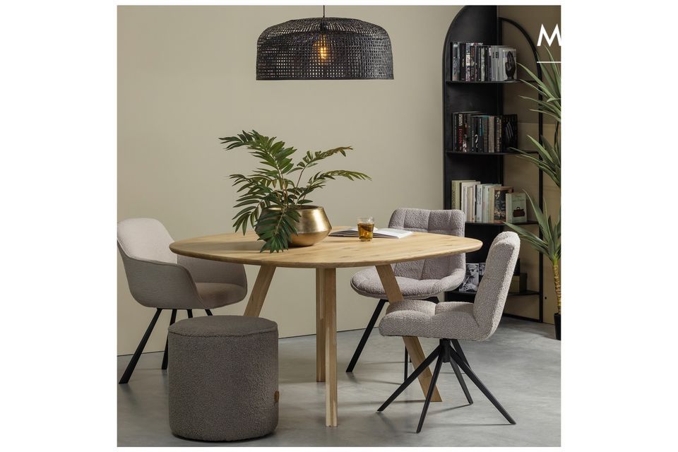 This chic and understated dining table is playful with the organic shape its top gives it