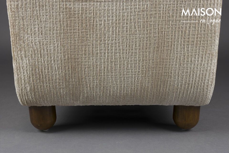 Its soft cream fabric upholstery