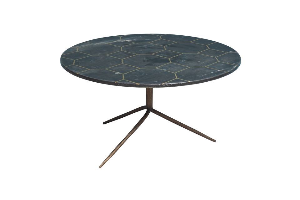Circular in shape, this table features a grey marble top set with brass in a honeycomb pattern