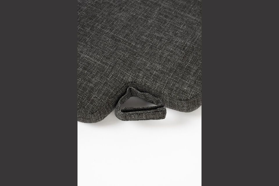 This black cushion is a versatile piece that blends perfectly with a variety of furniture styles