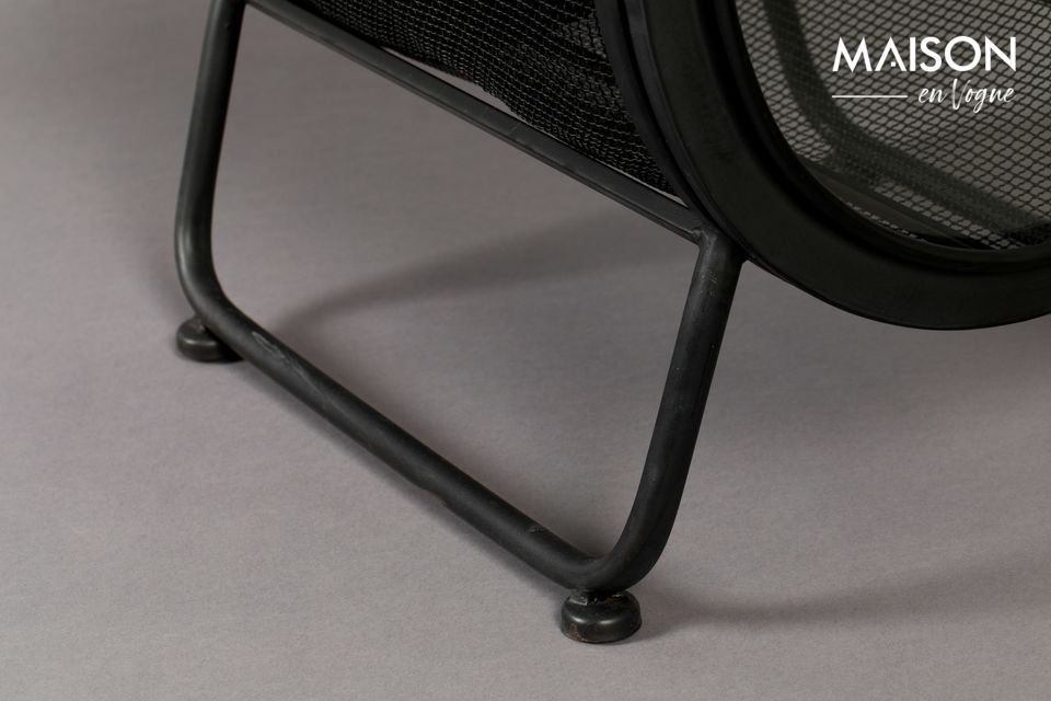 The oval chest stands on black lacquered iron tube feet