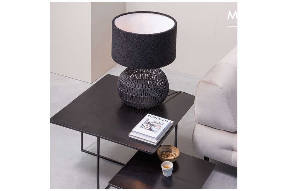 This Macy black rattan lamp is sure to catch the eye of all your guests during your evenings with