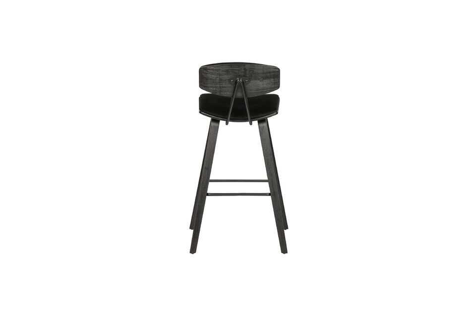 Perched on high black plywood legs, it offers a curved and padded seat for optimal comfort