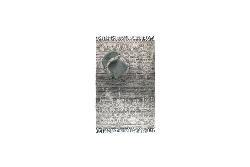 Not only does the rug present the refined appearance of a weathered vintage rug