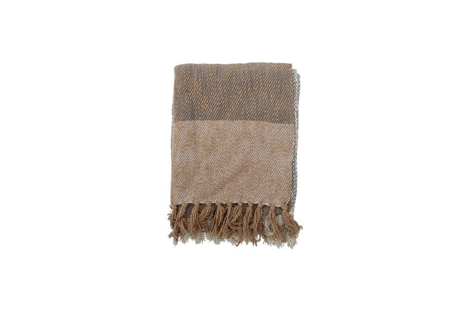 It is also beautifully fringed at the ends in shades of brown and natural