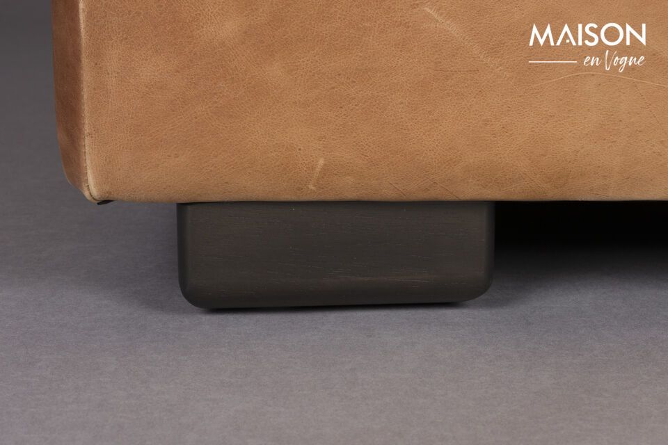 Its rounded shapes and wooden legs underline the welcoming