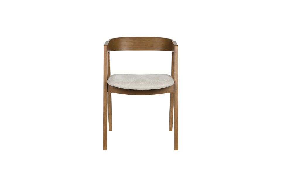 The harmony created by the contrast between the fabric and the dark hue of the wood evokes