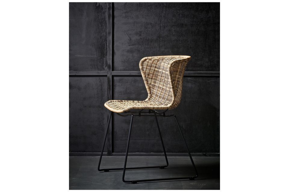 Pretty trendy chair in rattan and black steel.