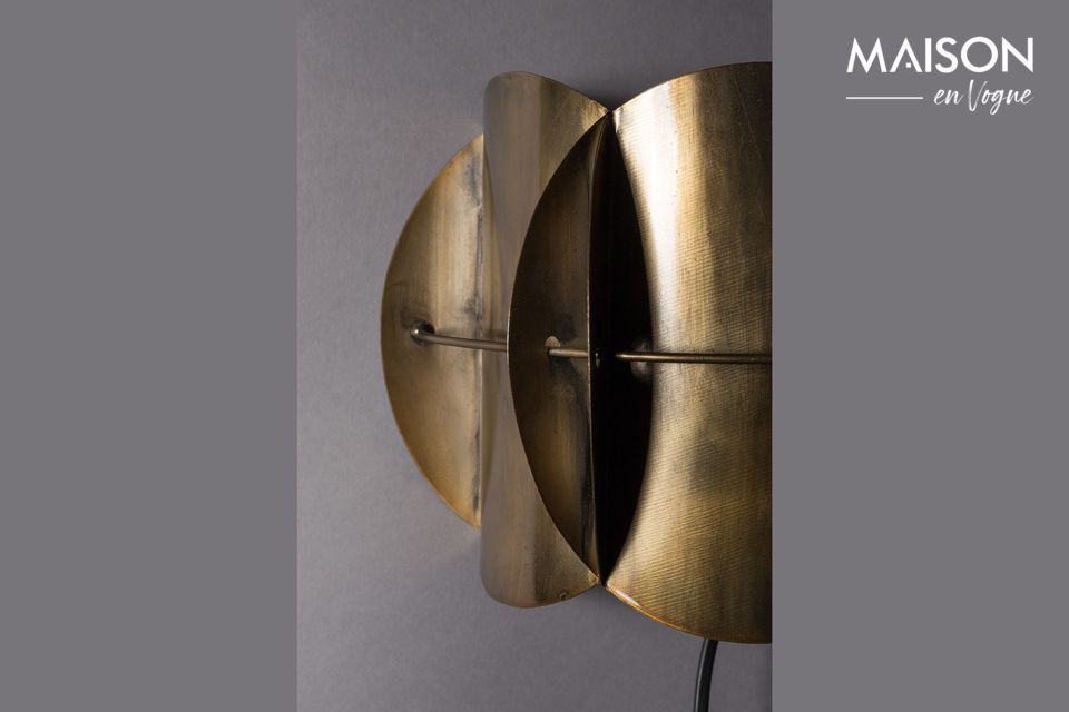 An artistic arrangement of aged brass pieces, this luminaire imposes its character