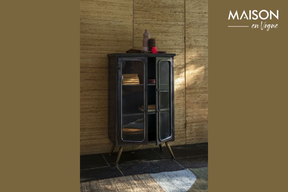 The treatment given to the metal gives this sideboard a brown hue reminiscent of certain dark woods