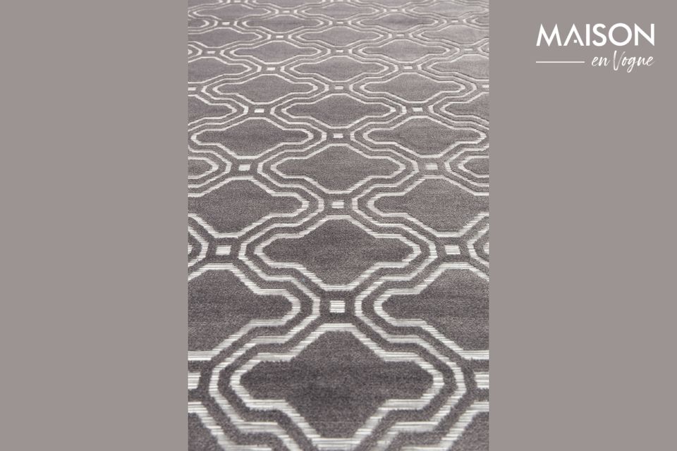 It will make an impression in your living room with its geometric pattern in relief and bicolour