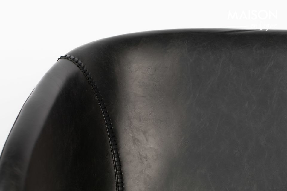 This comfortable chair is supported by a steel frame that runs on either side of the room