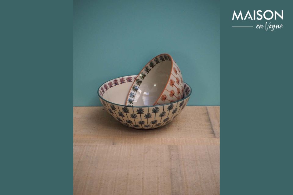 This elegant Flabella bowl, made of ceramic, reveals very fine patterns with a vegetal resonance