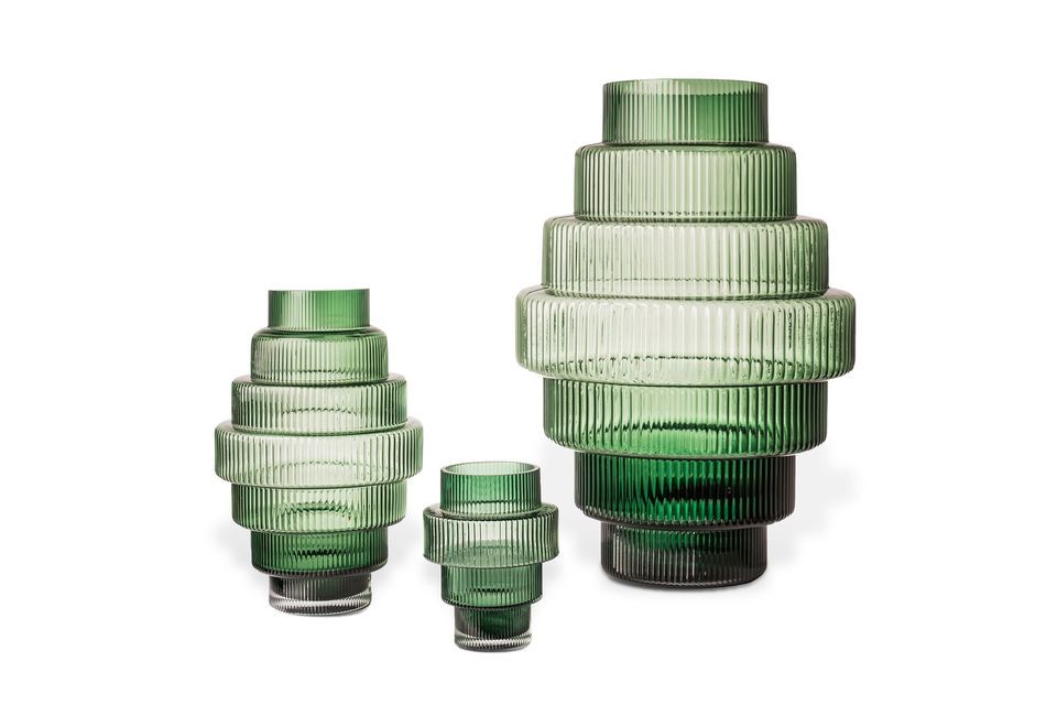 Made of solid colored glass, the Steps green glass candleholder features a beautifully nuanced shade
