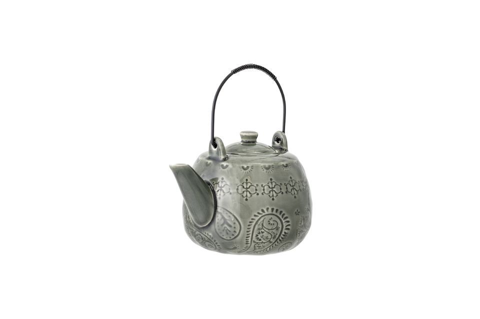 It has an iron tea strainer and handle