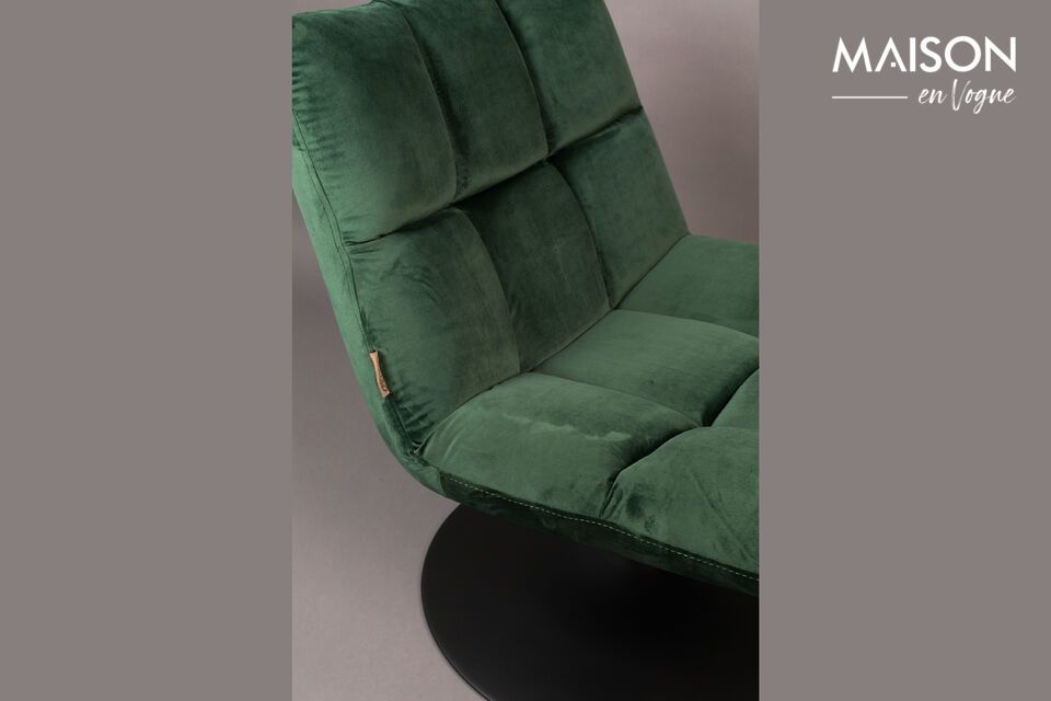 With a round black steel base, this lounge chair has a green velvet covering for a refined contrast