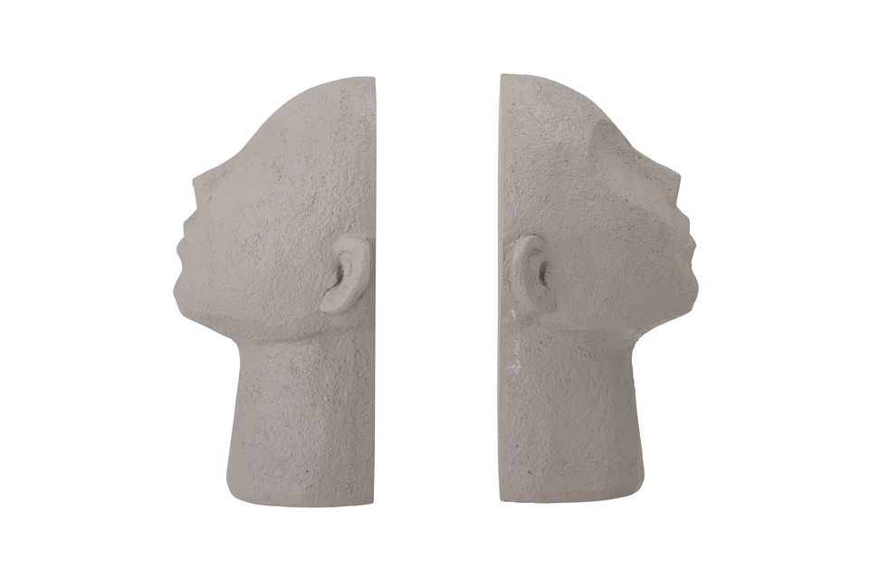 The bookends are made of gray polyresin, and each element simulates a tribal face looking sideways