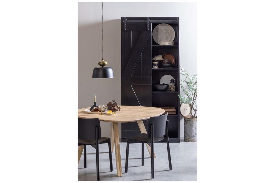 This black solid pine cabinet is a creation of the Harris collection for the Dutch brand WOOD