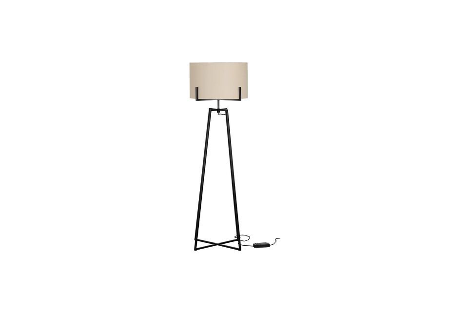Made of black metal and featuring a white shade, this floor lamp will fit into any interior style