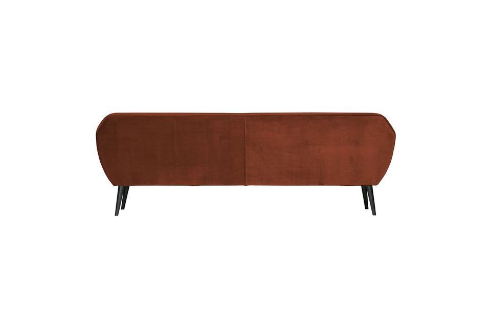 This modern sofa is designed for four people and is upholstered in a 100% polyester velvet