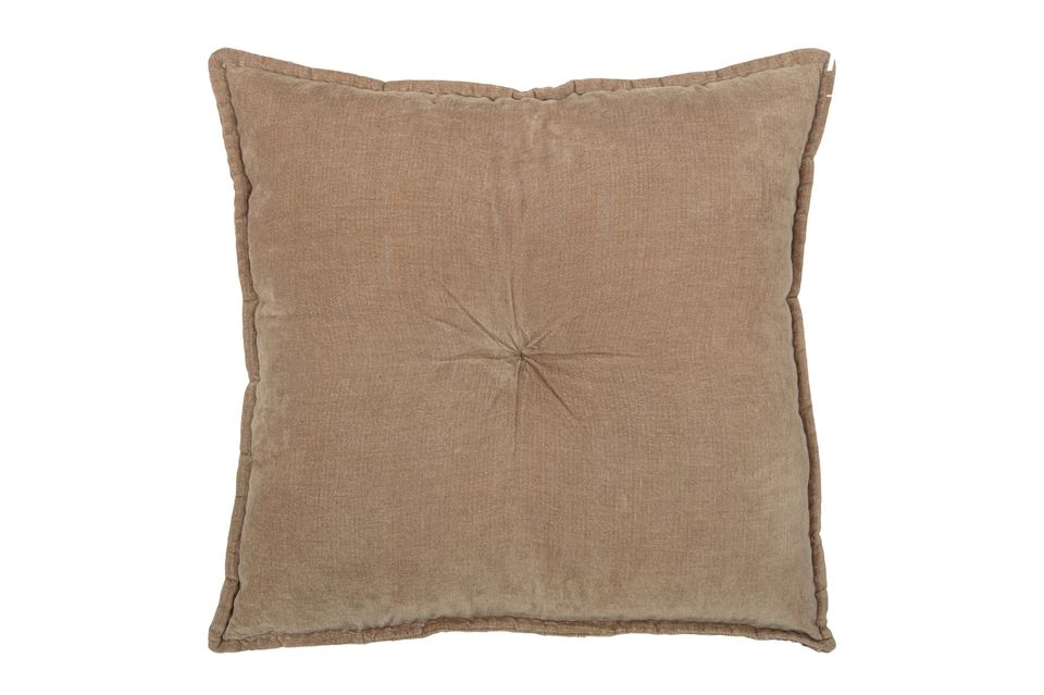 This decorative cushion with its embroidered border and playful bow was designed by the brand WOOD