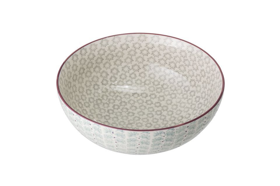 The Mayan stoneware salad bowl features discreet blue-tinted plant motifs framed by purple dots that