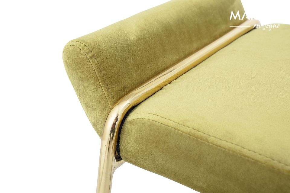 A seat that catches the eye with its golden metal