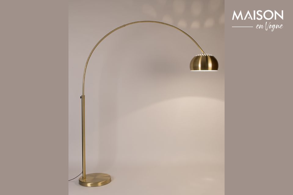 With its overhanging arch and brass shade