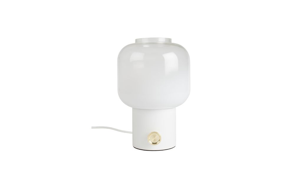 A large, round, golden knob is an integral part of the lamp\'s design