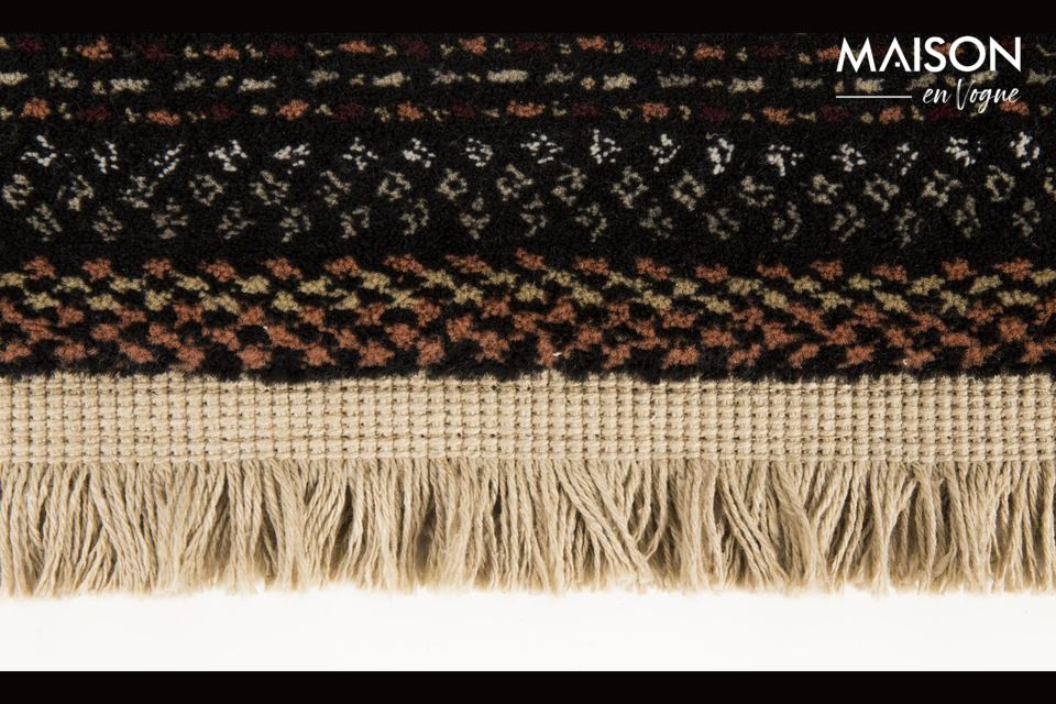 With its fringes and colourful pattern inspired by Nepalese hand weaving