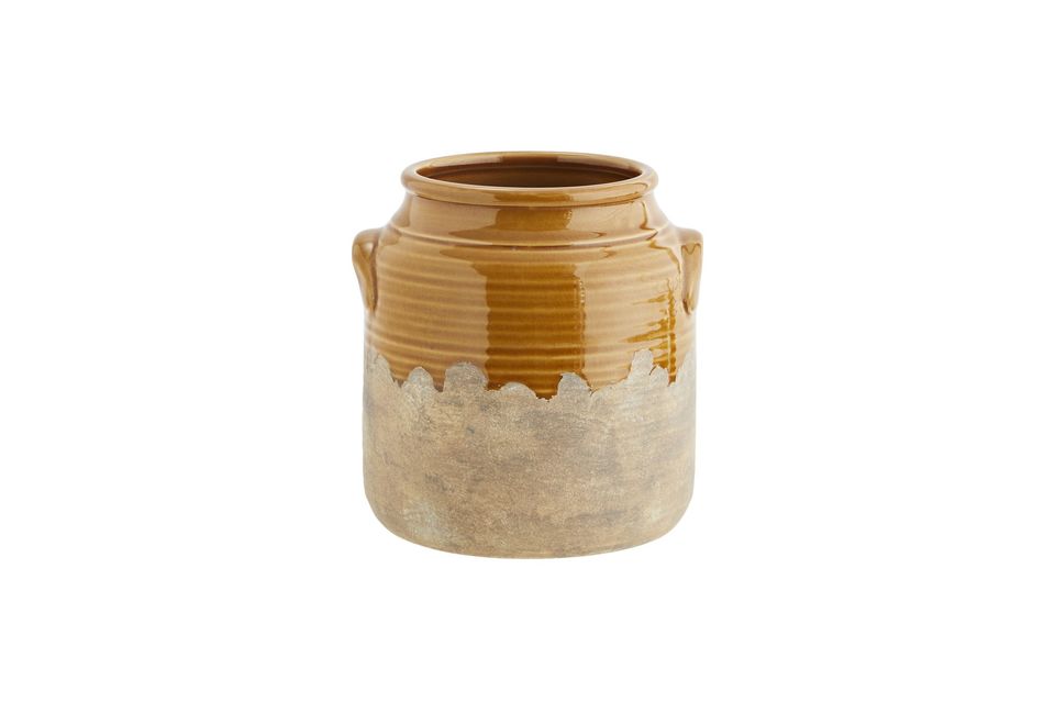 This stoneware vase looks like an old food jar which gives it a retro feel