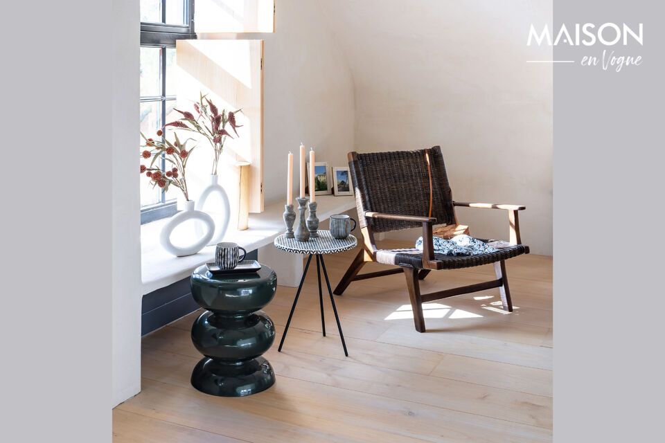 Add a touch of nature with this rattan armchair.