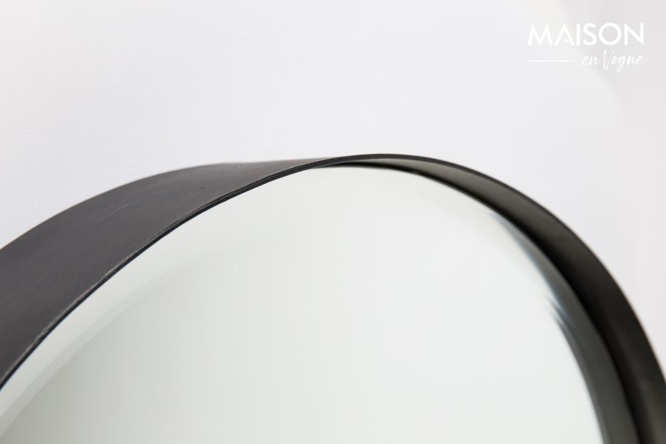 A modern circular faceted mirror