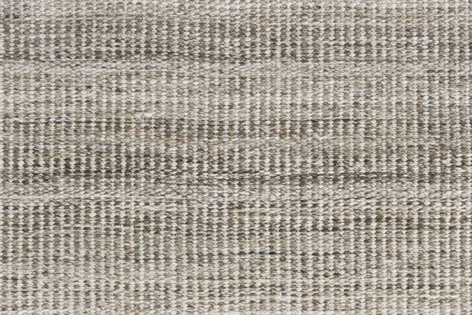 The Lorenzo rug is available in two discreet shades - brown and grey - for perfect harmony with a