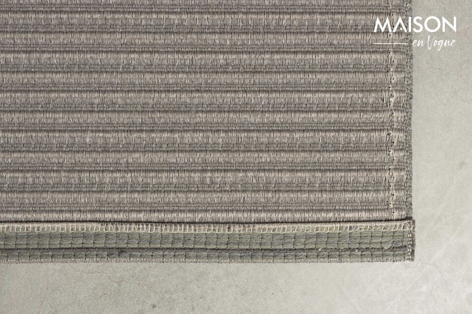 The lightly embossed striped design of this rug not only catches the eye
