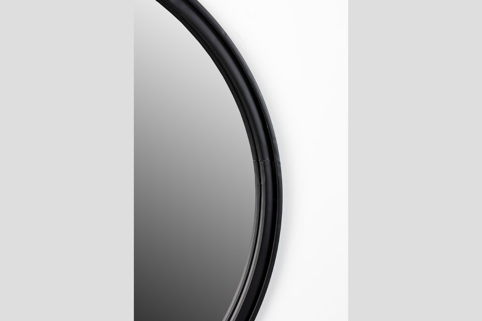 Its black lacquered iron frame and flock coating give it a modern yet timeless look