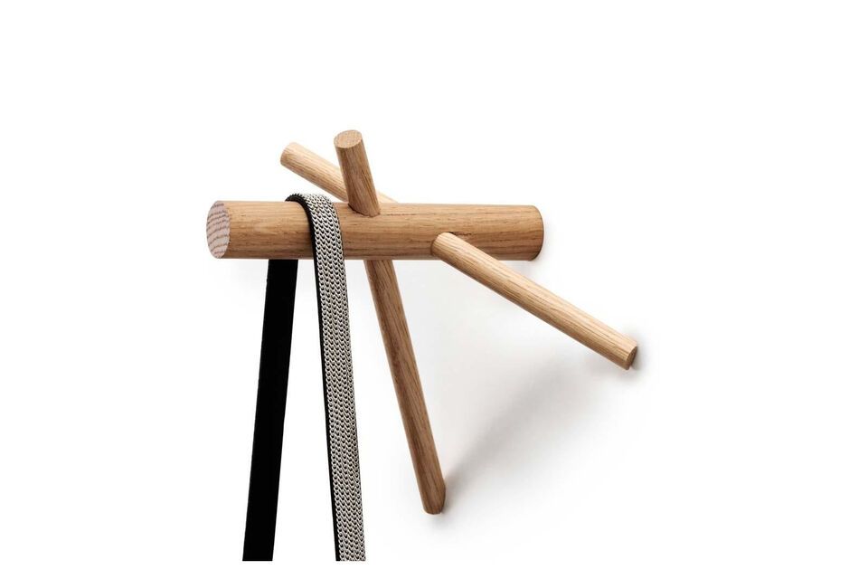 The simple construction made of three sticks creates a functional and decorative hook providing