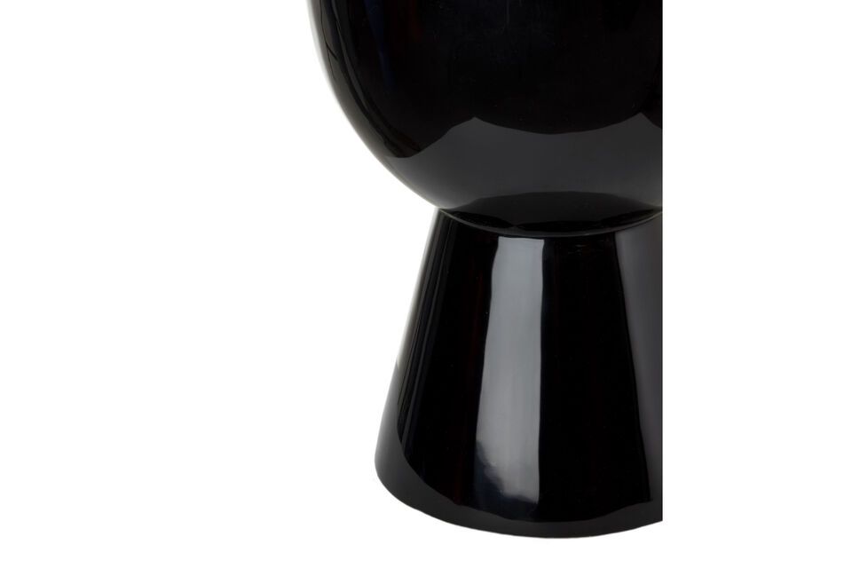 The Tam Tam is a side table and a stool with clean curves that are enhanced by a lacquered finish