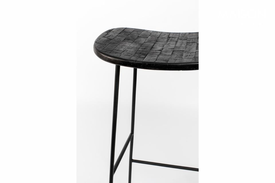 The narrow legs of the black bar stool are all joined by thin crossbars