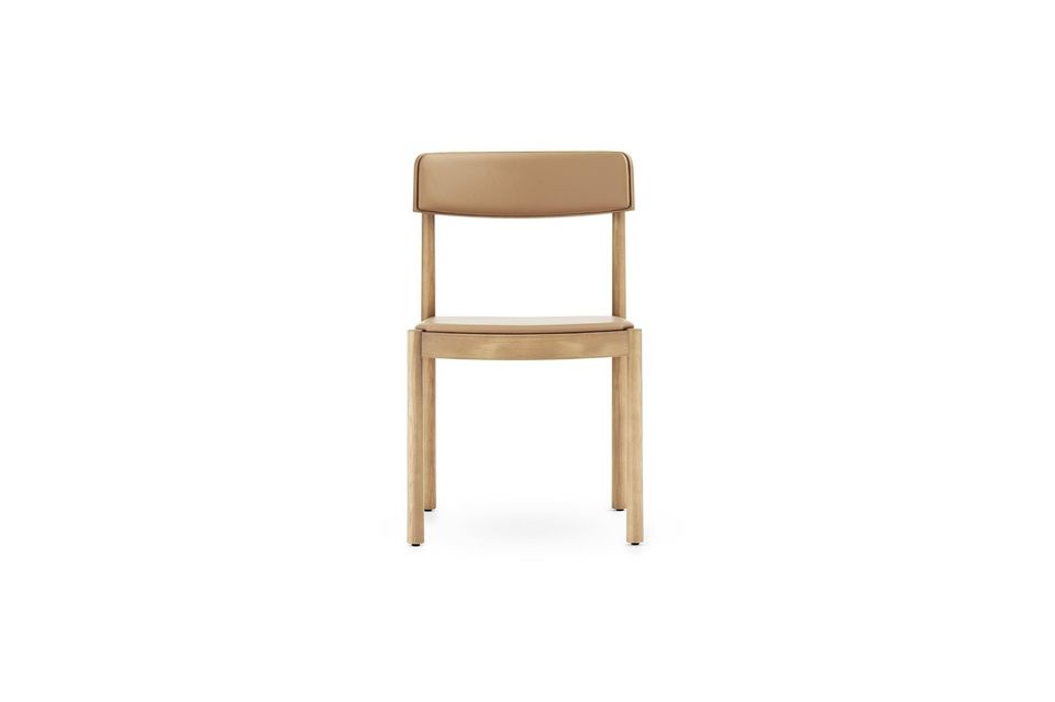 The Timb chair has a simple wooden structure with a richness of detail in the contrast between its