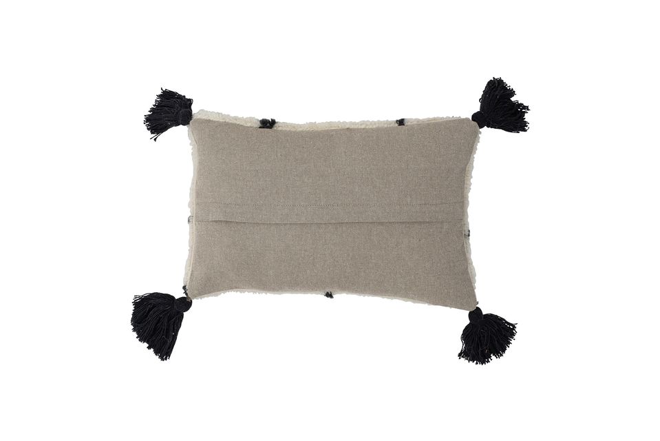 The Ayn pillow from Bloomingville is a small rectangular pillow made of tufted wool blend