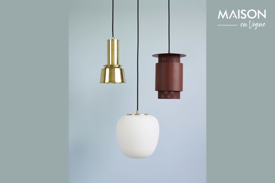 A light fixture in opaline enhanced by a piece of golden brass