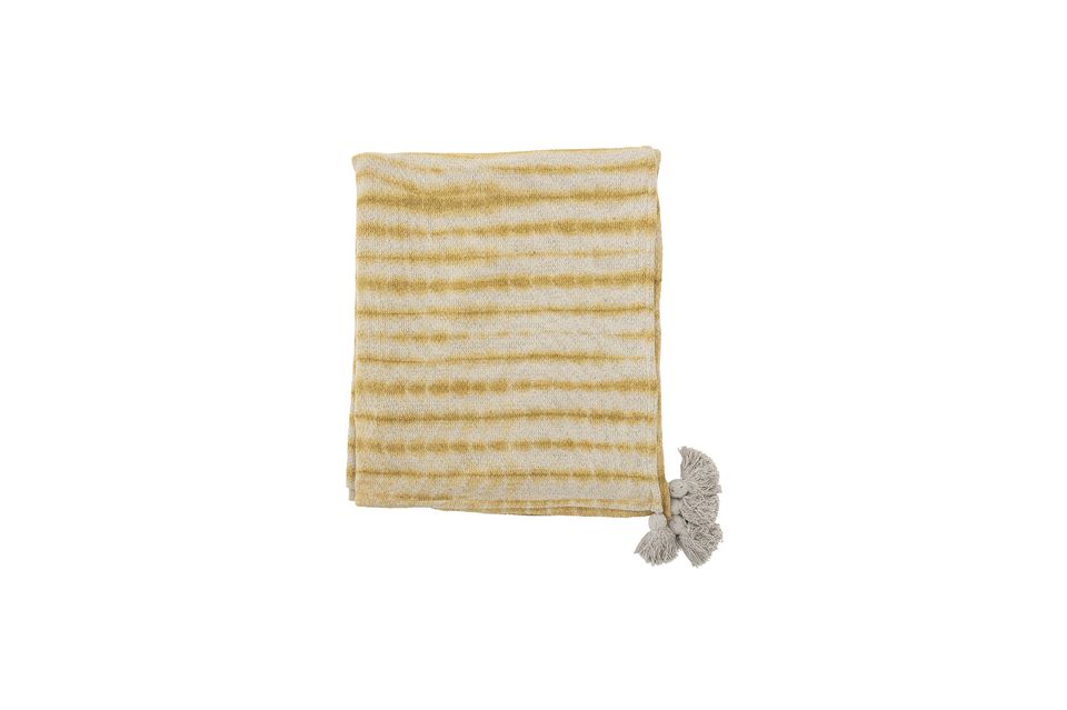 It\'s made of recycled cotton, with yellow stripes and fringe at the corners